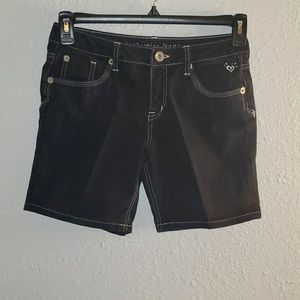Justice black with white trim jeans shorts.